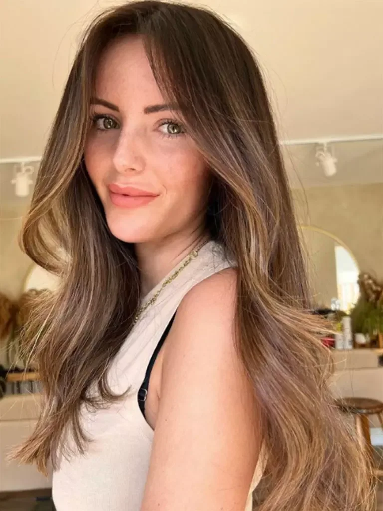 chest wavy black braid shown as a wedding hairstyles ideas for long hair idea
