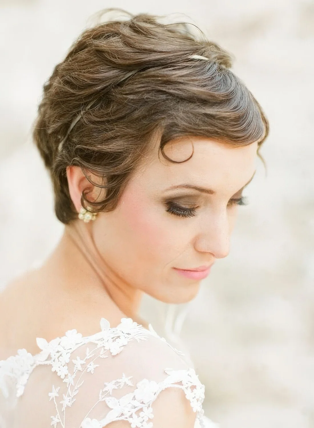 Long brunette pixie haircut with waves.
