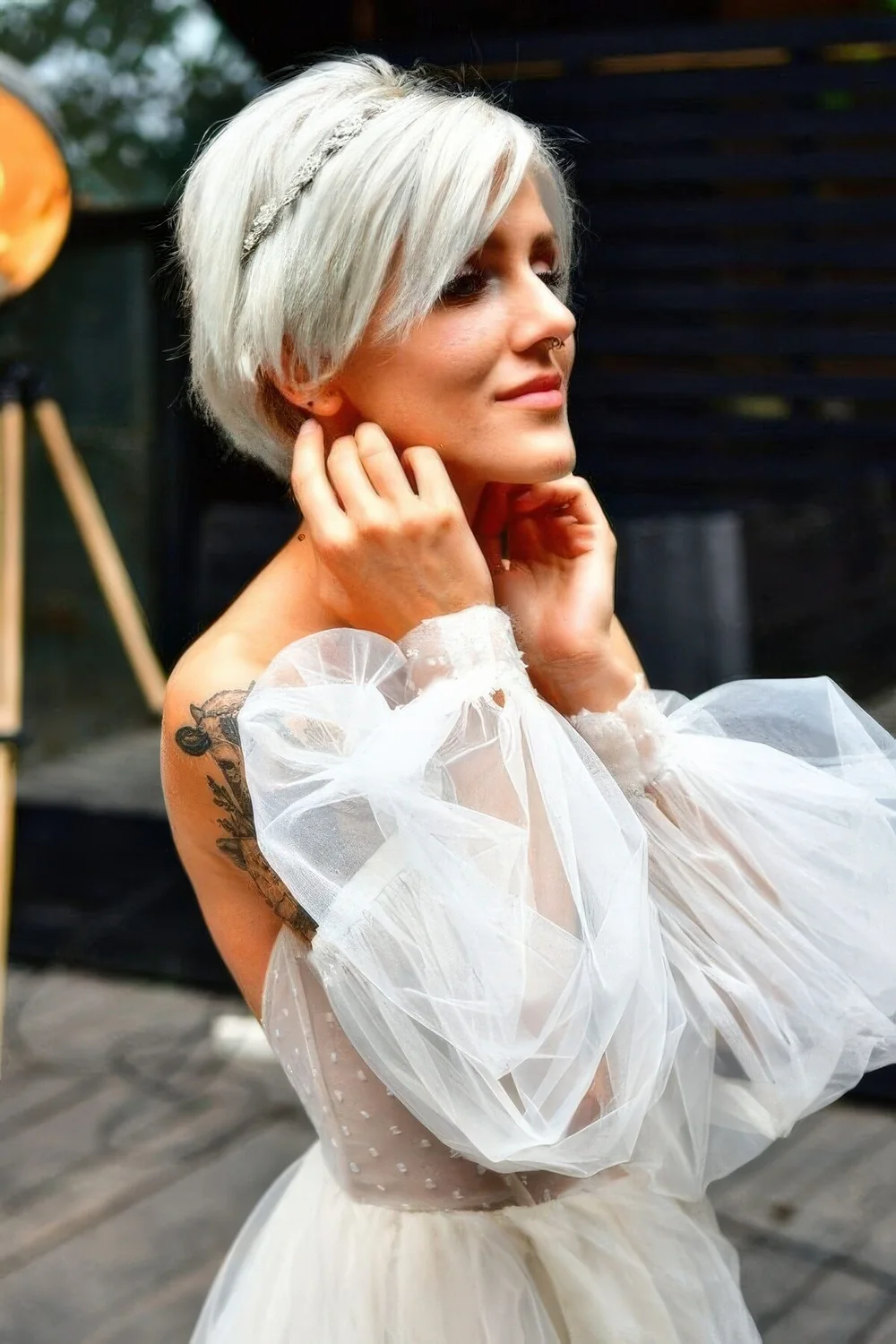 Long platinum blonde pixie with a rhinestone headband are an adorable combo for a wedding.