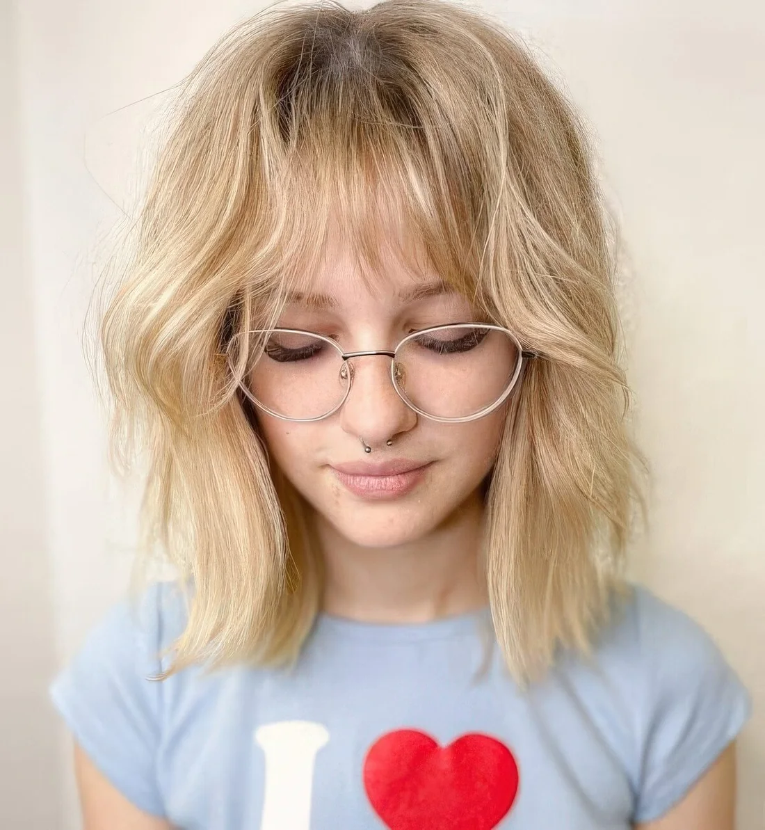 This blonde hairstyle with long bangs.