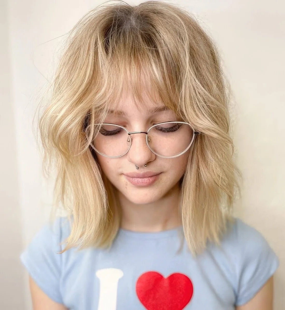 This blonde hairstyle with long bangs.