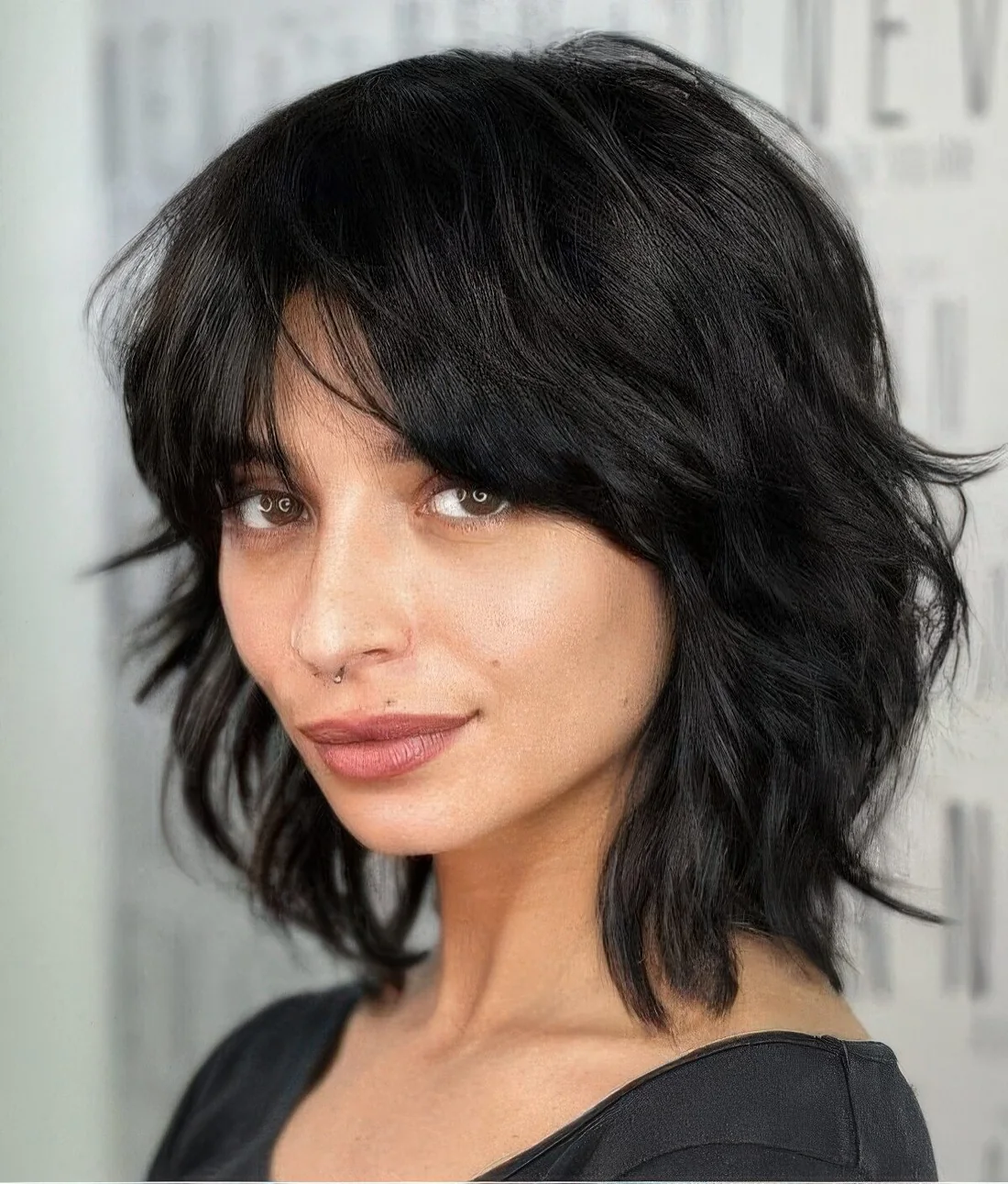 Photo showing medium wolf cut hairstyle, with the hairstyle clearly visible.