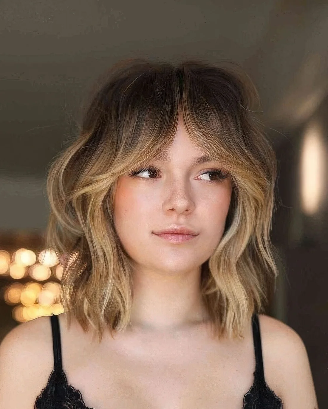 Photo showing hairstyle with a blonde balyage, with the hairstyle clearly visible.