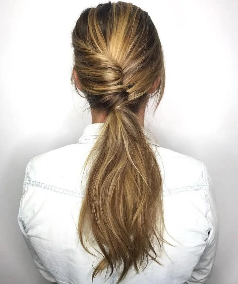 Photo showing twisted low pony, with the hairstyle clearly visible.