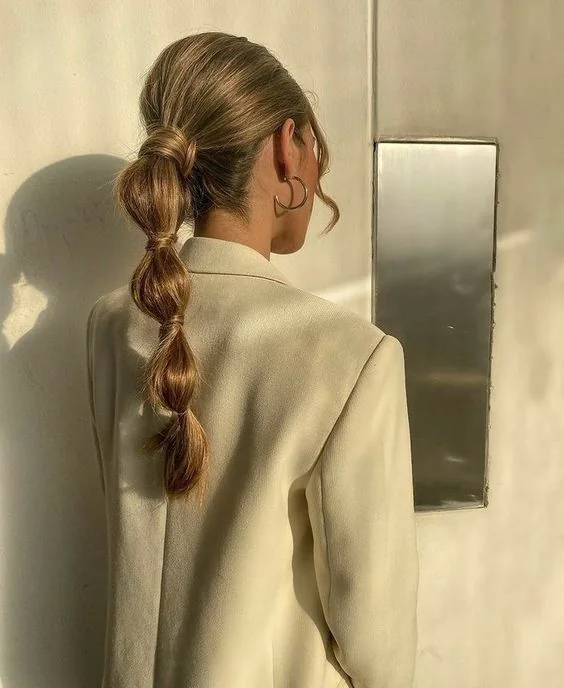 Photo showing bubble ponytail, with the hairstyle clearly visible.