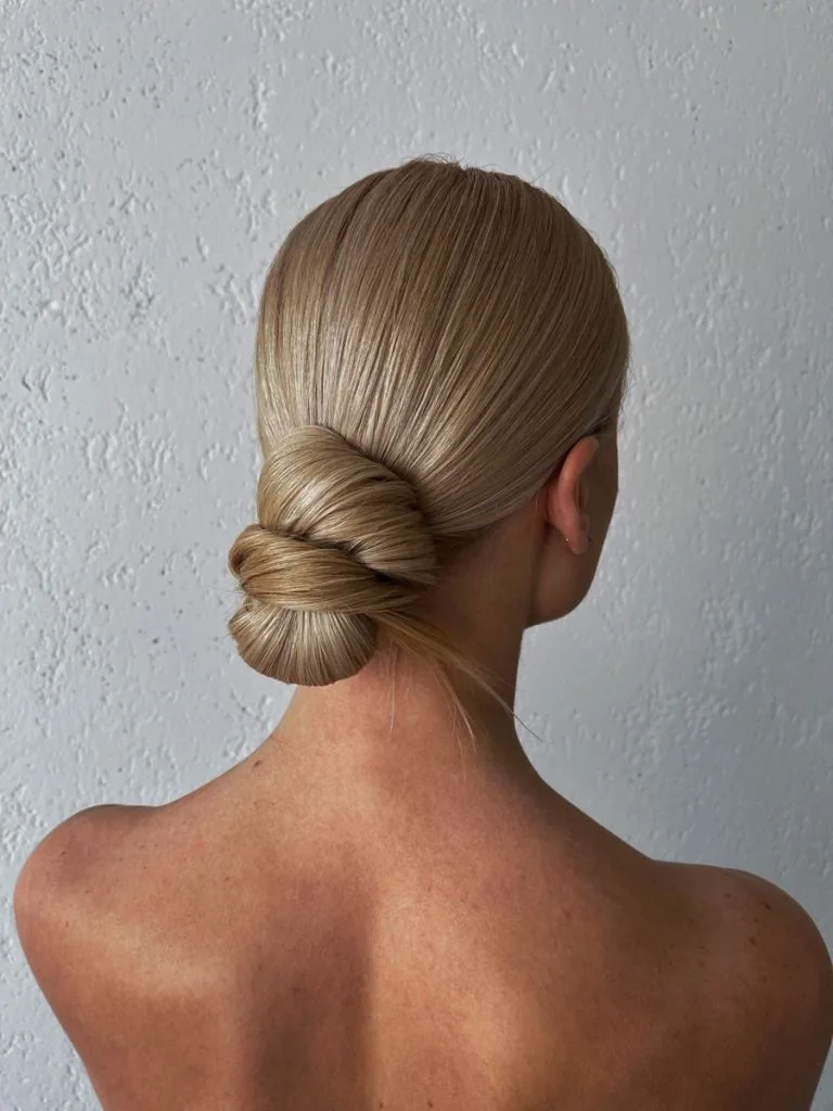Photo showing formal bun, with the hairstyle clearly visible.