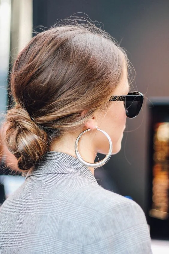 Photo showing messy bun, with the hairstyle clearly visible.