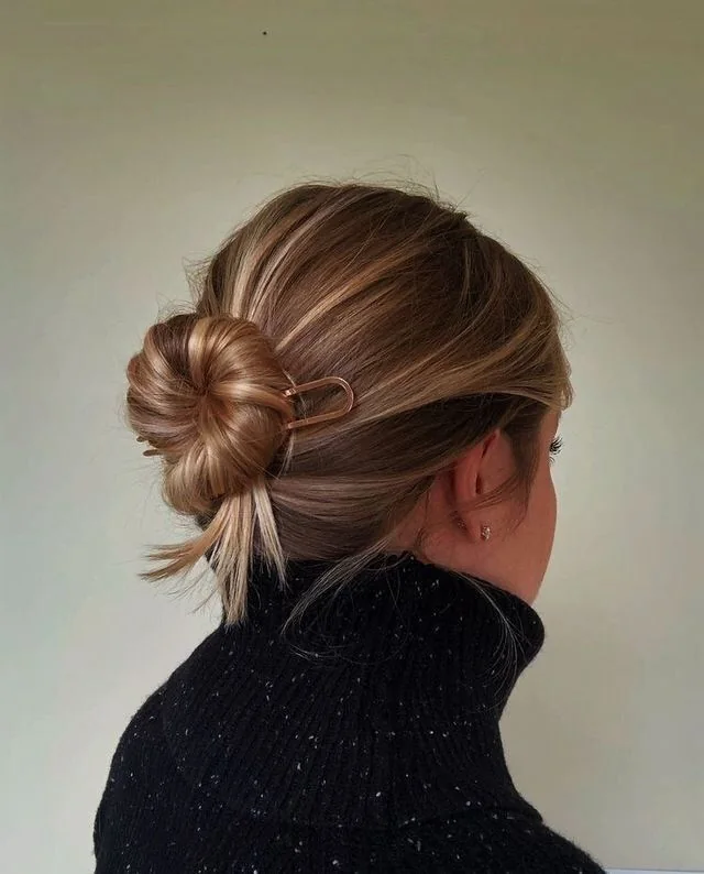 Photo showing midi ballerina bun, with the hairstyle clearly visible.