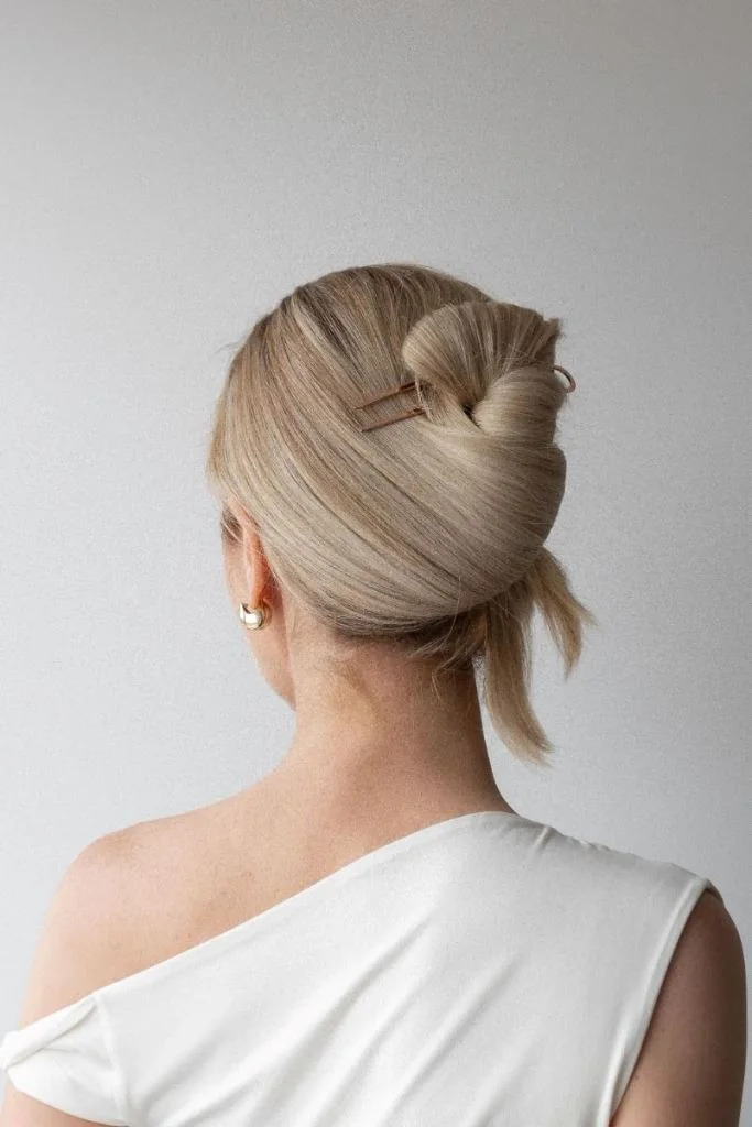 Photo showing french twist updo, with the hairstyle clearly visible.