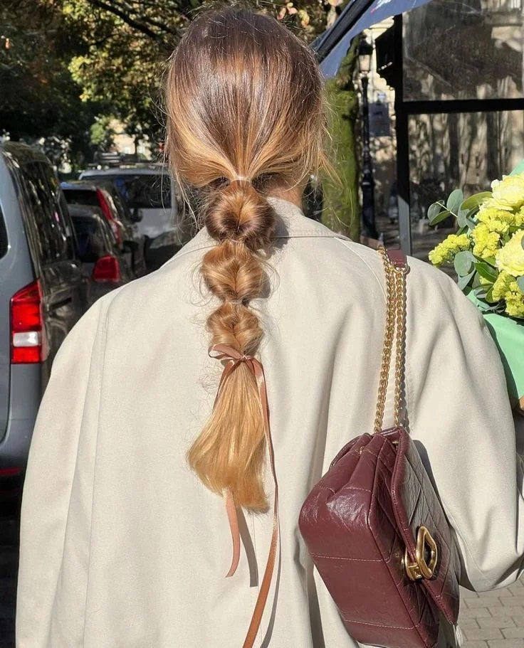 Photo showing bubble braid, with the hairstyle clearly visible.